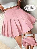 Falda plisada rosa - vista completa con tenis blancos